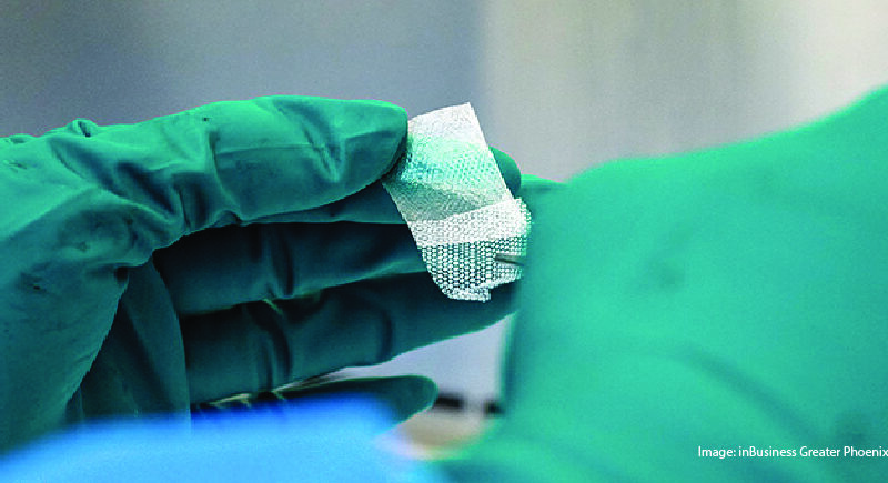 Healthcare professional holding advanced technology.