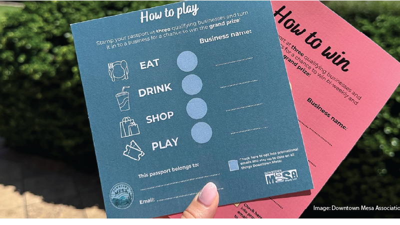 Mesa visitor or resident holding new summer passport promotion to be used in Downtown Mesa